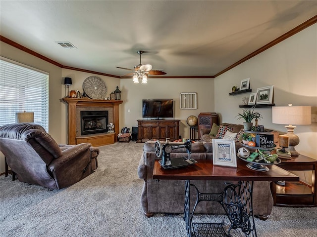 9021 NW 81st St, Yukon, OK 73099 - carpeted living room featuring crown molding, ceiling fan, and a fireplace with raised hearth