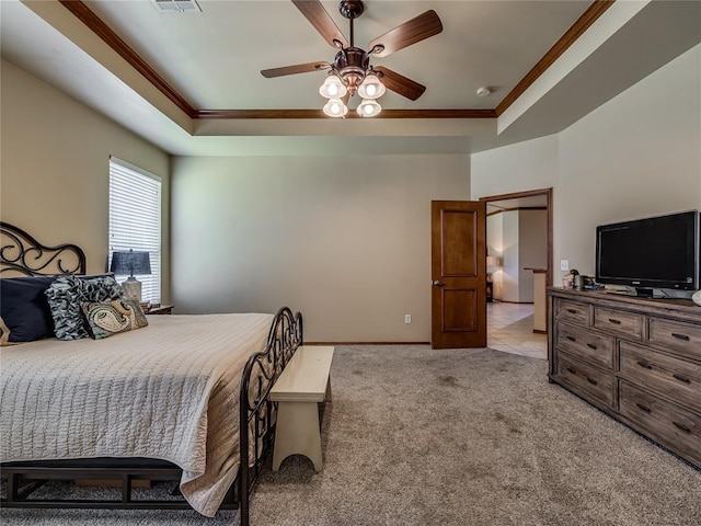 9021 NW 81st St, Yukon, OK 73099 - carpeted bedroom featuring a tray ceiling, crown molding, and a ceiling fan