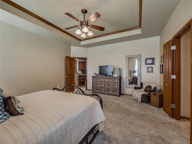 9021 NW 81st St, Yukon, OK 73099 - bedroom featuring a raised ceiling, light carpet, ornamental molding, and ceiling fan