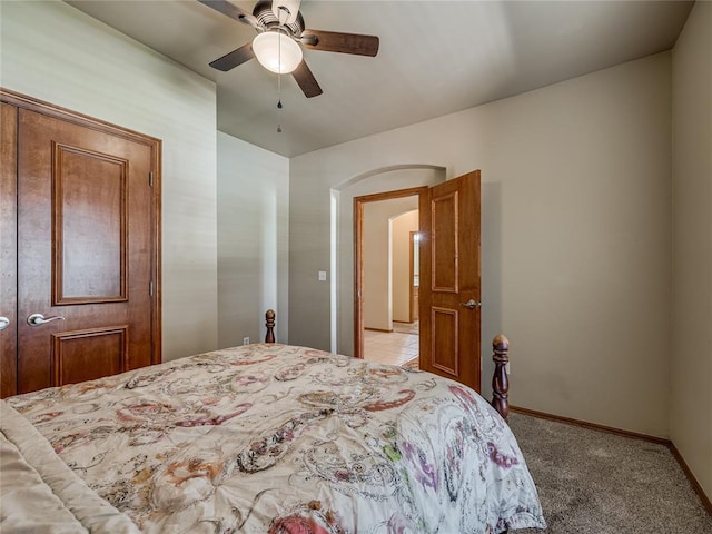 9021 NW 81st St, Yukon, OK 73099 - bedroom with light colored carpet and a ceiling fan