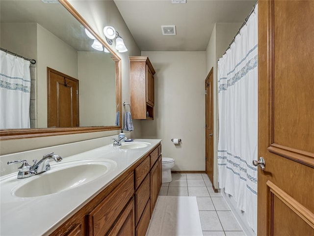 9021 NW 81st St, Yukon, OK 73099 - bathroom featuring double vanity, tile patterned floors, and a shower with curtain