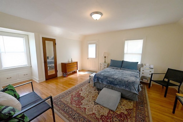 1712 W University Ave, Stillwater, OK 74074 - bedroom with light wood-type flooring