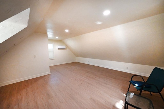 1712 W University Ave, Stillwater, OK 74074 - bonus room featuring a wall mounted AC, wood finished floors, vaulted ceiling, and recessed lighting