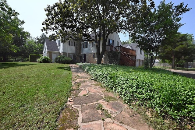 1712 W University Ave, Stillwater, OK 74074 - view of front of home featuring a front lawn, stairs, and stone siding