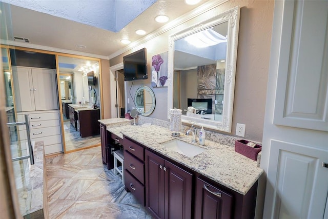 2202 NW 45th St, Oklahoma City, OK 73112 - full bath featuring crown molding, vanity, marble tiled flooring, and recessed lighting