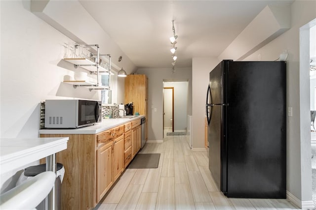 2202 NW 45th St, Oklahoma City, OK 73112 - kitchen featuring freestanding refrigerator, open shelves, light countertops, stainless steel dishwasher, and track lighting