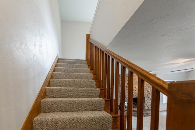 2202 NW 45th St, Oklahoma City, OK 73112 - stairway with a ceiling fan and a textured wall