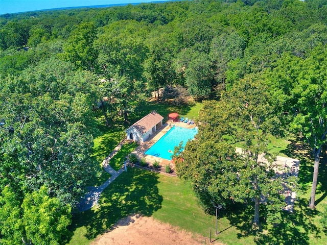 56201 E 285th Rd Unit F36, Afton, OK 74331 - view of property location featuring a forest and a pool area