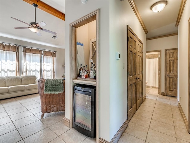 56201 E 285th Rd Unit F36, Afton, OK 74331 - corridor with beverage cooler, light tile patterned floors, beam ceiling, and crown molding