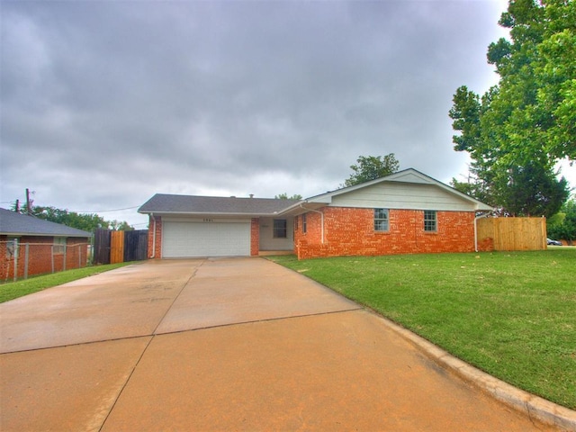 5901 Seminole Rd, Warr Acres, OK 73132 - ranch-style home featuring brick siding, an attached garage, and concrete driveway