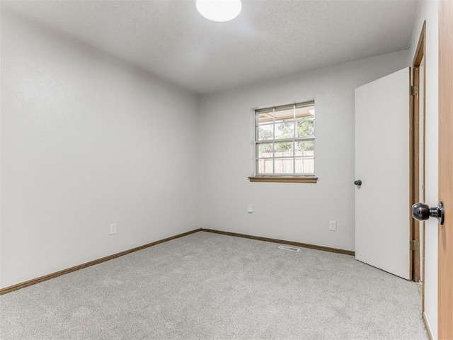 5901 Seminole Rd, Warr Acres, OK 73132 - spare room featuring carpet floors and baseboards