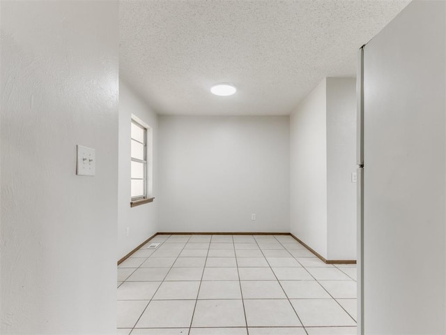 5901 Seminole Rd, Warr Acres, OK 73132 - unfurnished room with a textured ceiling and baseboards