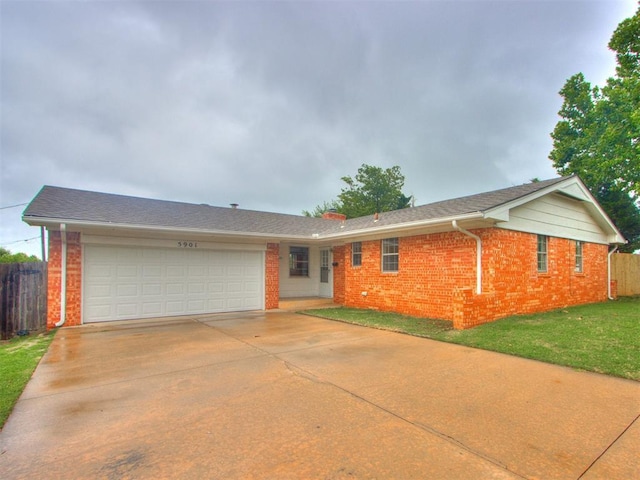 5901 Seminole Rd, Warr Acres, OK 73132 - ranch-style house featuring brick siding, an attached garage, and driveway