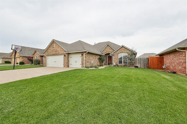 921 Tea Rose Dr, Yukon, OK 73099 - view of front of house with an attached garage, concrete driveway, brick siding, and a shingled roof