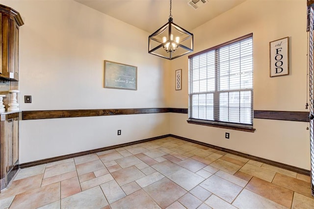 921 Tea Rose Dr, Yukon, OK 73099 - unfurnished dining area with a chandelier and baseboards