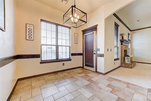 921 Tea Rose Dr, Yukon, OK 73099 - entrance foyer with arched walkways, a chandelier, and a fireplace