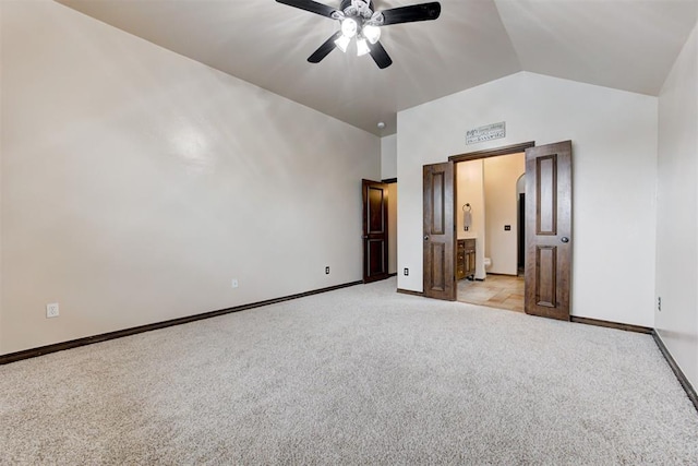 921 Tea Rose Dr, Yukon, OK 73099 - unfurnished bedroom featuring light carpet, high vaulted ceiling, a ceiling fan, and connected bathroom