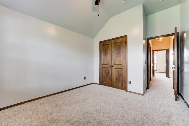 921 Tea Rose Dr, Yukon, OK 73099 - unfurnished bedroom with light colored carpet, vaulted ceiling, and ceiling fan