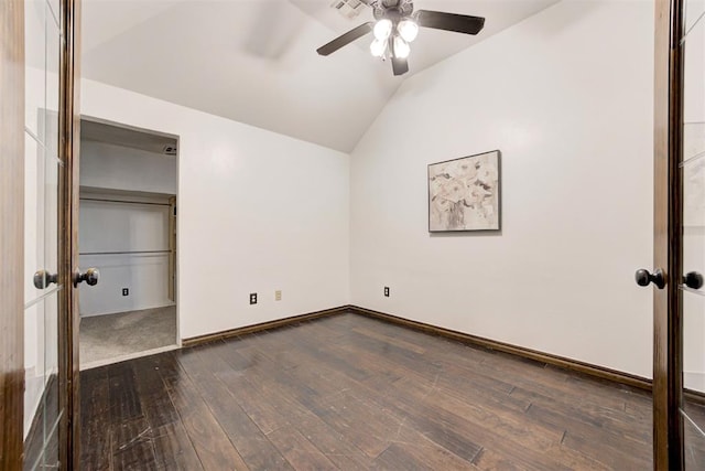 921 Tea Rose Dr, Yukon, OK 73099 - unfurnished bedroom with vaulted ceiling, dark wood-type flooring, and a ceiling fan