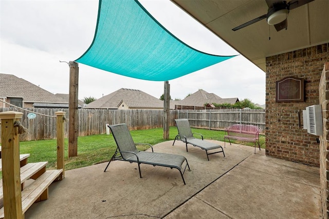 921 Tea Rose Dr, Yukon, OK 73099 - fenced backyard featuring ceiling fan and a patio