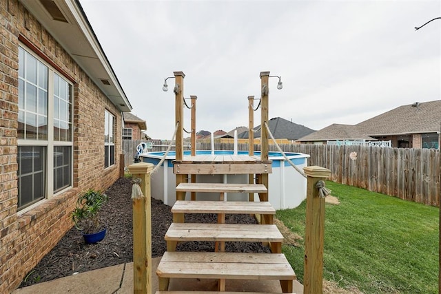 921 Tea Rose Dr, Yukon, OK 73099 - wooden deck with a fenced backyard