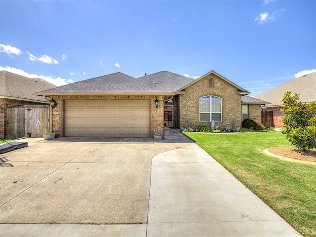 516 SW 161st St, Oklahoma City, OK 73170 - ranch-style house with driveway, brick siding, an attached garage, and roof with shingles