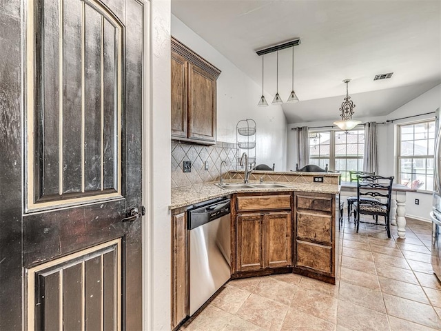 516 SW 161st St, Oklahoma City, OK 73170 - kitchen featuring dishwasher, a peninsula, backsplash, pendant lighting, and vaulted ceiling