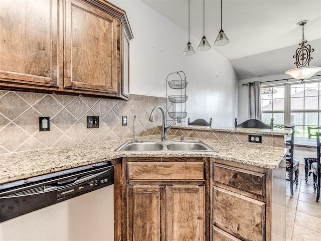 516 SW 161st St, Oklahoma City, OK 73170 - kitchen featuring stainless steel dishwasher, a peninsula, lofted ceiling, backsplash, and hanging light fixtures