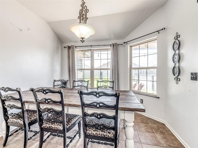 516 SW 161st St, Oklahoma City, OK 73170 - tiled dining space featuring lofted ceiling and baseboards