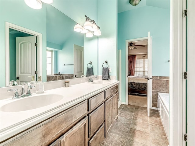 516 SW 161st St, Oklahoma City, OK 73170 - ensuite bathroom featuring lofted ceiling, double vanity, and a bath