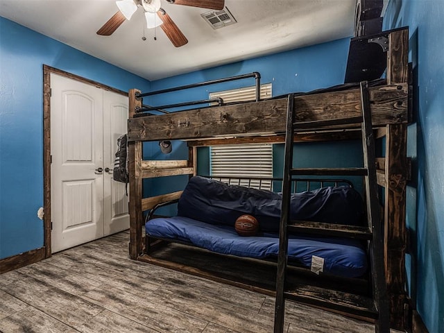 516 SW 161st St, Oklahoma City, OK 73170 - bedroom featuring wood finished floors and ceiling fan