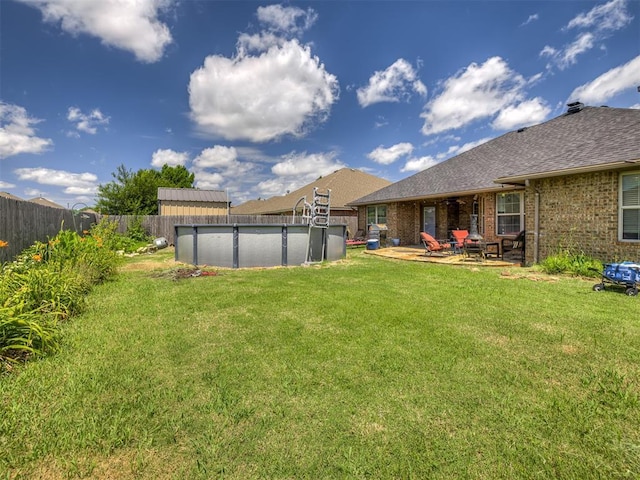 516 SW 161st St, Oklahoma City, OK 73170 - fenced backyard with a patio area
