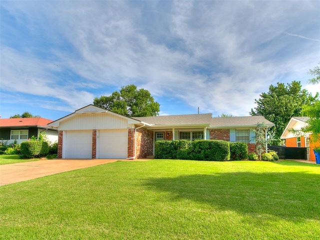 1917 Barryton Rd, Oklahoma City, OK 73120 - ranch-style home with a front yard, an attached garage, brick siding, and concrete driveway