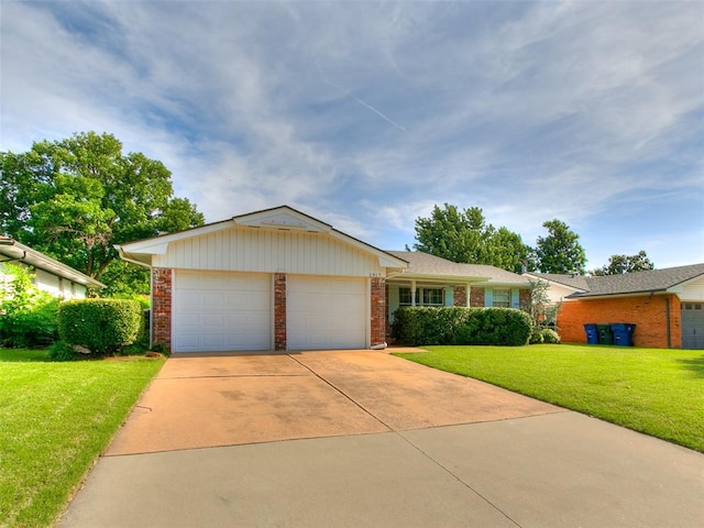 1917 Barryton Rd, Oklahoma City, OK 73120 - ranch-style house featuring brick siding, a front lawn, an attached garage, and driveway