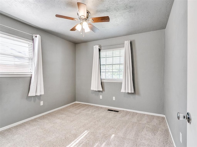 1917 Barryton Rd, Oklahoma City, OK 73120 - unfurnished room featuring a ceiling fan, a textured ceiling, and carpet floors