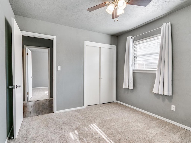 1917 Barryton Rd, Oklahoma City, OK 73120 - unfurnished bedroom featuring carpet, a textured ceiling, a closet, and ceiling fan