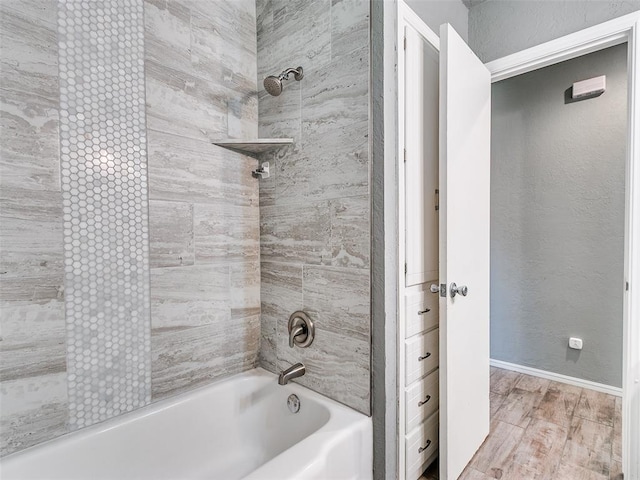 1917 Barryton Rd, Oklahoma City, OK 73120 - bathroom featuring tub / shower combination and wood finished floors
