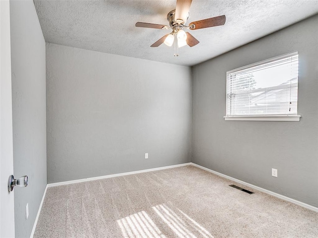 1917 Barryton Rd, Oklahoma City, OK 73120 - carpeted spare room featuring a ceiling fan and a textured ceiling