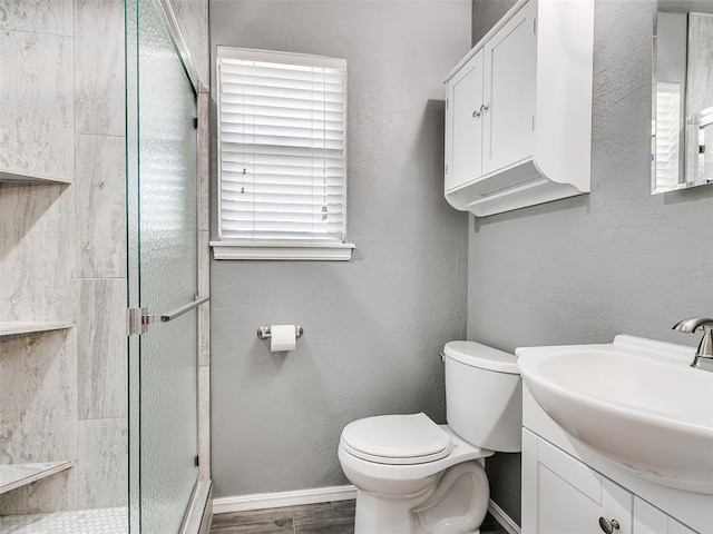 1917 Barryton Rd, Oklahoma City, OK 73120 - bathroom with a shower stall, vanity, and wood finished floors