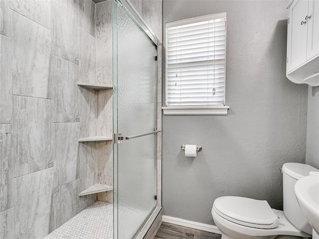 1917 Barryton Rd, Oklahoma City, OK 73120 - bathroom featuring a shower stall and wood finished floors