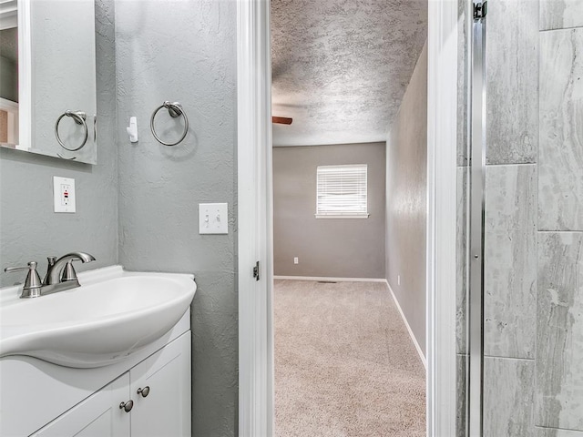 1917 Barryton Rd, Oklahoma City, OK 73120 - bathroom with vanity, a textured ceiling, and a textured wall