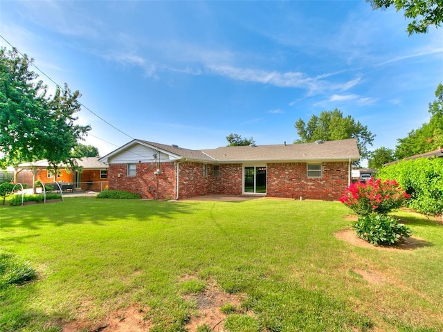 1917 Barryton Rd, Oklahoma City, OK 73120 - back of property with brick siding and a patio
