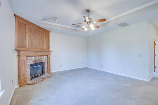 4621 Deer Ridge Blvd, Yukon, OK 73099 - unfurnished living room featuring ceiling fan, light carpet, a fireplace, and a raised ceiling