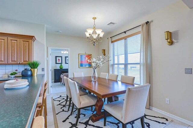 4621 Deer Ridge Blvd, Yukon, OK 73099 - dining room featuring a chandelier and light tile patterned floors