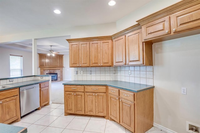 4621 Deer Ridge Blvd, Yukon, OK 73099 - kitchen featuring stainless steel dishwasher, dark countertops, ceiling fan, a glass covered fireplace, and recessed lighting