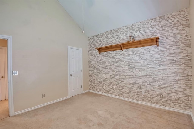 4621 Deer Ridge Blvd, Yukon, OK 73099 - empty room featuring light carpet and high vaulted ceiling