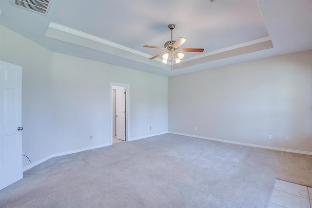 4621 Deer Ridge Blvd, Yukon, OK 73099 - carpeted empty room with a raised ceiling, ceiling fan, and crown molding