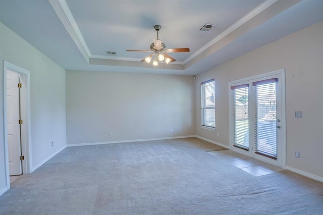 4621 Deer Ridge Blvd, Yukon, OK 73099 - carpeted spare room with a tray ceiling, ceiling fan, and crown molding