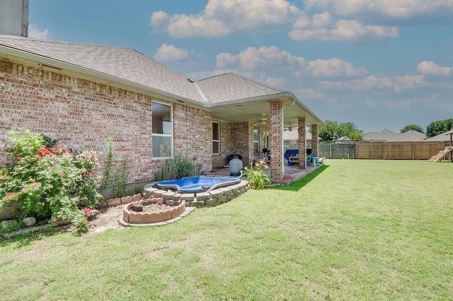 4621 Deer Ridge Blvd, Yukon, OK 73099 - fenced backyard featuring a hot tub and a patio area