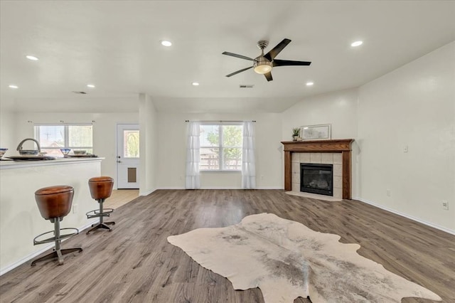 11321 NW 103rd St, Yukon, OK 73099 - living room featuring wood finished floors, a fireplace, recessed lighting, and a ceiling fan
